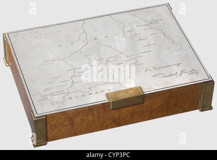A silver presentation cigarette box for the 1939 Polish campaign,10th Mounted Rifles Regiment.Cedar with figured amboine veneer.Brass corners and feet.Silver lid engraved with a map of Poland and 'Feldzug in Polen 1939'(Campaign in Poland 1939)on the upper left,and 'In Erinnerung Rudolf Kinsky'(In Memory - Rudolf Kinsky)at the lower right.A detailed enumeration of the(transl.)'Movements and Actions Fought by the 10th Mounted Rifle Regiment from 1 September to 24 September 1939' inside.The silversmith's signature 'Carl Hiess Wien I',the hallmark '9,Additional-Rights-Clearences-Not Available Stock Photo