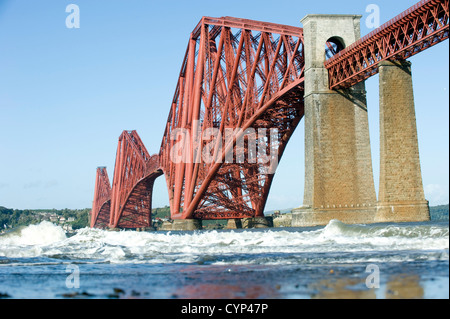 The newly painted (2012) Forth Bridge pictured from the shore of the Firth of Forth at South Queensferry, Fife Scotland. Stock Photo