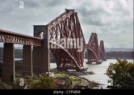 The newly painted (2012) Forth Bridge pictured from the shore of the Firth of Forth at North Queensferry, Fife Scotland. Stock Photo