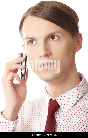 Serious businessman talking via cell phone on a white background Stock Photo