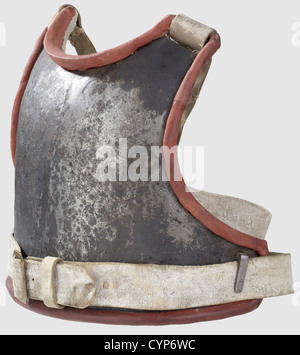 A model 1715 cuirass for enlisted men,Slightly ridged,hammered iron breastplate,lateral iron strap hooks.Only fragments of the original black paint remain.Renewed straps,using old material from the Kassel theatre properties,new red leather border-trim and linen liner,the inside lower edge with Nuremberg maker's marks(shield with 'W.K.& S.1,18').Weight 2,320 g.This cuirass comes from an order of 9,000 pieces commisioned by Frederick William I in 1715,originally with a leather liner.It presumably entered the collection of G.Petschke as part of a 19,Additional-Rights-Clearences-Not Available Stock Photo