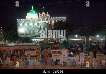 A beautiful illuminated view of the Shrine of Hazrat  Abdullah Shah Ghazi (R.A) on the event of his Annual Urs at his Shrine in Karachi on Thursday,  November 08, 2012. Devotees flock to the Shrine to celebrate the Urs (death anniversary) of the  Ghazi (R.A), from the 20th to the 22nd of the lunar month, this year corresponding to the 6th, 7th  and 8th of November, today is the last day of the event and observed a large count devotees visit  shrine Stock Photo