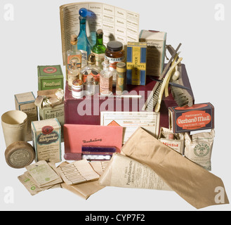 Anny Winter/Adolf Hitler - cardboard box from the Luitpold Pharmacy,in Bogenhausen. Containing a number of various objects used by Hitler between 1925 and 1935. Apart from several medical items such as 'Freisinger Hexengeist'(a liqueur),'Lactana-Milchzucker'(milk sugar),originally packaged 'Papier-Closenettes'(paper toilet seat covers),an empty tin box of 'Spitzwegerich-Zeltchen'(cough pastilles),spruce needle herbal bath,'Desi-Spritz' disinfectant,absorbent gauze or inhalants there are also a toothbrush,two coat brushes,a paper cup,a Frenc histor,Additional-Rights-Clearences-Not Available Stock Photo