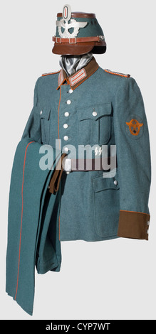 A uniform ensemble for an Oberwachtmeister,of Gendarmerie. Brown-lacquered fibreglass shako with police green cover(mothy),supplemented aluminium eagle and insignia. Field tunic of police green woolen fabric with brown facings and collars,orange-coloured piping and depot stamp. Insignia newly stitched. Long trousers of corresponding material with orange piping and depot stamp. Belt with aluminium buckle. NCO sword with nickel fittings,maker 'Krebs Solingen',SS NCO sword knot. Rusty,historic,historical,1930s,1930s,20th century,object,objects,stills,Additional-Rights-Clearences-Not Available Stock Photo