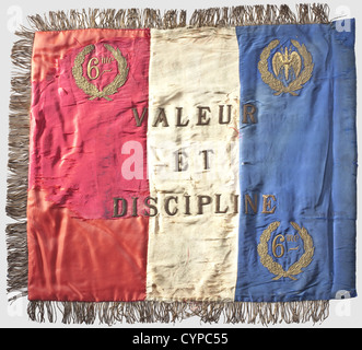 A standard of the 6ème Régiment de Cuirassiers,Second Republic 1848 - 1851 Three-piece tricolour silk cloth with golden fringes.On the front side embroidered continuous inscription 'Unité - Liberté - Egalité - Fraternité',in the centre 'République Fran‡aise 6éme Régiment de Cuirassiers,On the reverse side 'Valeur et Discipline'.The corners of both sides with '6me' and winged,bundled thunderbolts within laurel and oak leaves wreaths(one is missing on the reverse side at the lower left).Age-related defects and repairs.Dimensions 62 x 72 cm.An outright r,Additional-Rights-Clearences-Not Available Stock Photo