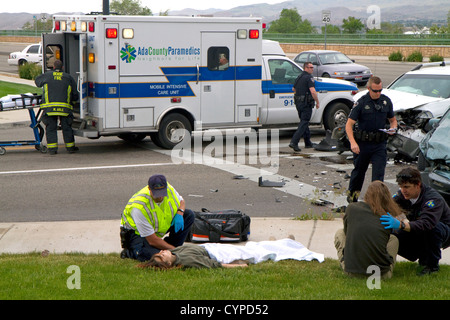 Paramedics and firefighters respond to an automobile injury accident in Boise, Idaho, USA. Stock Photo