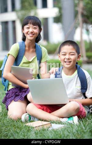 Elementary students with high-tech digital products Stock Photo