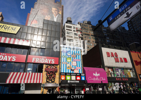 Restaurants and other businesses along West 34th Street in the Herald Square shopping district of New York Stock Photo