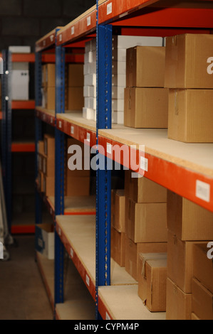 Rows of shelves with cardboard boxes in modern warehouse Stock Photo ...
