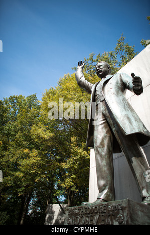 ARLINGTON, Virginia — The Theodore Roosevelt Memorial stands as a serene island amidst the Potomac River. The wooded 88-acre site, accessed by a footbridge, features a statue of the 26th president, surrounded by granite tablets inscribed with his notable quotations. Stock Photo