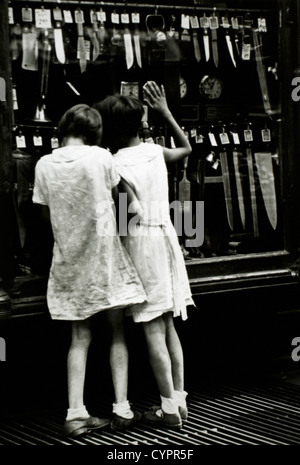 Two Girls Looking in Store Window, Circa 1940 Stock Photo