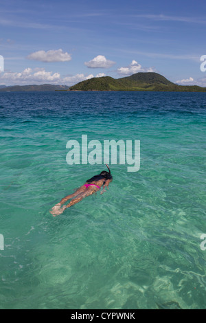 Girl snorkelling in the waters off Pass Island,Coron,Palawan.Philippines Stock Photo