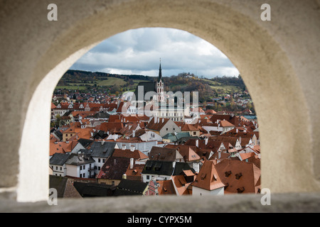 Historical center of Ceske Krusovice seen through window in castle wall, Czech Republic. UNESCO World Heritage Site Stock Photo