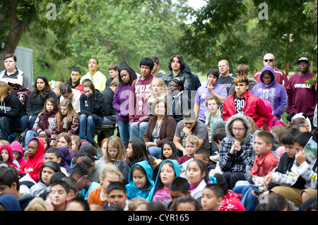 Junior high school students listen to a speaker during a field trip to Milam County in central Texas on a chilly autumn day Stock Photo