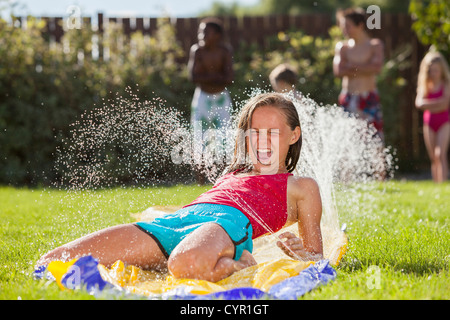Caucasian girl playing in water Stock Photo
