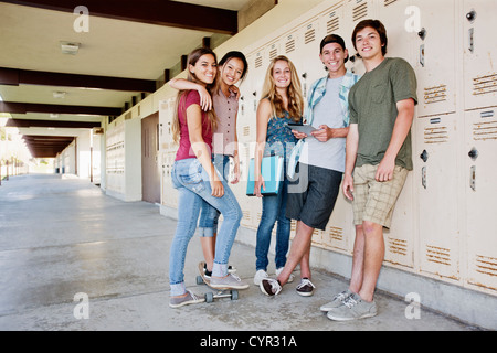 School friends hanging out in portico Stock Photo