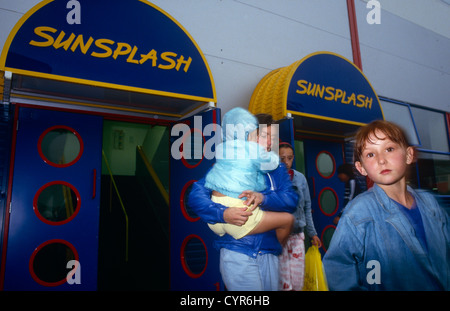 Holidaymakers at Butlins in Minehead, emerge into a dull afternoon after a session in the Sunsplash swimming pool. Stock Photo