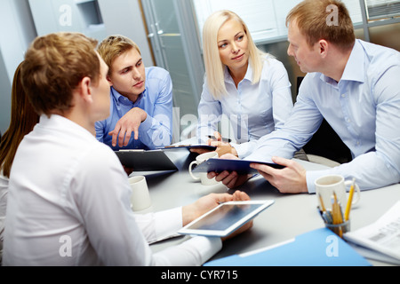 Image of group of employees discussing new ideas or project at meeting Stock Photo
