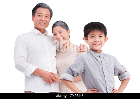 Cute boy with grandparents in background Stock Photo