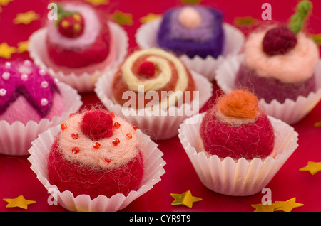 Christmassy assortment of colorful felt pralines Stock Photo