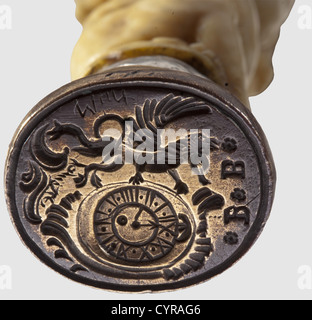 A German watchmaker's seal, 19th century Brass seal face bearing a rampant lion next to a watch dial beneath the monogram 'BB'. Finely carved ivory shaft with three intertwined cherubs and a ball finial. Height 10 cm, historic, historical, 19th century, handicrafts, handcraft, craft, object, objects, stills, clipping, clippings, cut out, cut-out, cut-outs, fine arts, art, artful, Additional-Rights-Clearences-Not Available Stock Photo