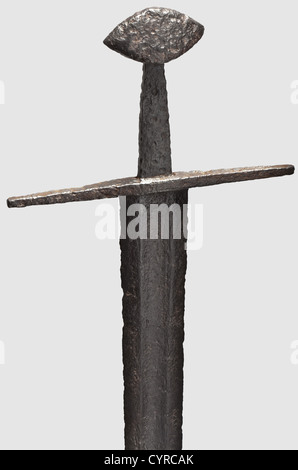 A German knightly sword,circa 1100 Robust double-edged blade with a wide central fuller on both sides,extending over nearly its full length. Residual traces of a blade inscription inlaid on one side of the forte. Extended quillons of square cross-section. Large,slightly tapered tang with a broad Brazil-nut shaped pommel. Cleaned and conserved excavation find. Length 94.5 cm. Very well preserved medieval sword. Oakeshot Type X,historic,historical,12th century,sword,swords,weapons,arms,weapon,arm,fighting device,military,militaria,object,objects,,Additional-Rights-Clearences-Not Available Stock Photo