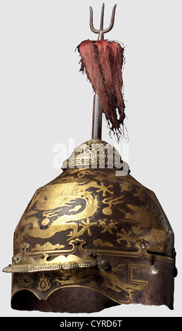 A Chinese gold-inlaid helmet for a member of the Imperial family,Qing Dynasty,18th century One-piece iron skull with two surrounding ridges and a riveted lower rim.The exterior embellished by a frieze of five gold-inlaid dragons,their feet with five claws.Riveted ornamentally pierced visor,the crown's apex of gilt brass.Six rivets for the(missing)neck-guard at the rear edge.The detachable iron trident finial old,but probably not associated.Height without finial 28.5 cm.Extremely rare,beautifully preserved helmet.As the depiction of five-clawed dr,Additional-Rights-Clearences-Not Available Stock Photo