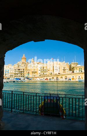 Buildings viewed from an arch, Grand Harbor, Valletta, Malta Stock Photo