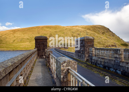 Road over the dam at Claerwen reservoir, Elan valley, Wales taken on sunny day Stock Photo