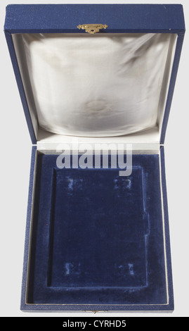 Adolf Hitler,an award case for the oversized amber edition of 'Mein Kampf' Dark blue linen cover,the interior lined in white silk and blue velvet. The inside cover and base show pressure marks from the decorative pins and national eagle. 30 x 24.6 x 8 cm. Appropriate size and type presentation case for the amber edition issued prior to 1938,historic,historical,1930s,20th century,NS,National Socialism,Nazism,Third Reich,German Reich,Germany,German,National Socialist,Nazi,Nazi period,fascism,object,objects,stills,clipping,clippings,cut out,,Additional-Rights-Clearences-Not Available Stock Photo