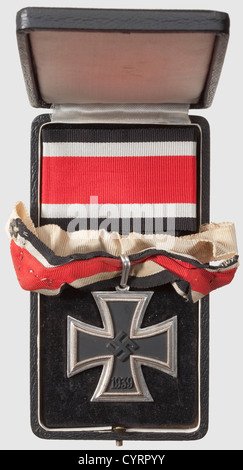 Generalmajor Gustav Adolf von Nostitz-Wallwitz,a Knight's Cross of the Iron Cross 1939,in case with two neck ribbons Blackened magnetic iron centre with edge-high swastika.Typical production for maker Klein & Quenzer.Silver frame with '800' mark of fineness,the suspension ring likewise marked '800' and '65',the Präsidialkanzlei number for Family Klein & Quenzer(Nie 7.03.08c).Black award presentation case with black velvet insert,the inside lid lined with white silk.The case is in near-mint condition,the lid with a slight bulge.Inside is a 54 cm leng,Additional-Rights-Clearences-Not Available Stock Photo