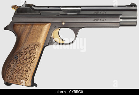 Commemorative pistol JP 210,1978,in its case,cal. 9 mm Parabellum,no. JP 054. Matching numbers. Bright bore. Eight shots. On left side of slide gold-inlaid engraving '125 Jahre - SIG - 1853 - 1978'. Complete original highly polished finish,grip frame lightly plum-coloured. Trigger,locking lever,safety and hammer gilded. Carved walnut grip panels. Magazine. Comes in walnut case with window,dimensions 30 x 20 x 9 cm,lined with red velvet,commemorative badge fitted in case bottom. Case key. Rare collectorïs item in brand new condition from a limited edit,Additional-Rights-Clearences-Not Available Stock Photo