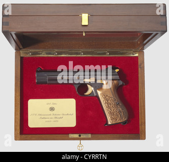 Commemorative pistol JP 210,1978,in its case,cal. 9 mm Parabellum,no. JP 054. Matching numbers. Bright bore. Eight shots. On left side of slide gold-inlaid engraving '125 Jahre - SIG - 1853 - 1978'. Complete original highly polished finish,grip frame lightly plum-coloured. Trigger,locking lever,safety and hammer gilded. Carved walnut grip panels. Magazine. Comes in walnut case with window,dimensions 30 x 20 x 9 cm,lined with red velvet,commemorative badge fitted in case bottom. Case key. Rare collectorïs item in brand new condition from a limited edit,Additional-Rights-Clearences-Not Available Stock Photo