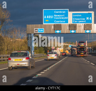 M4 motorway with cars and lorries in Wales with overhead gantry showing signs to London M4, near Cardiff, Wales Stock Photo