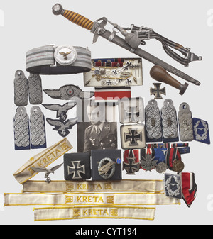 Knight's Cross winner Dr. Rolf Jäger(1912 - 1984),orders,decorations and insignia An extensive group consisting of four 'Kreta' cuff titles,an Iron Cross 1st Class by maker 'L 58'(Rudolf Souvall)with threaded disc attachment in LDO case,an Iron Cross 1st Class without maker's mark in award case,a further EK1(no maker),and a Parachutist's Badge(maker Berg & Nolte,Lüdenscheid)in award case. Further,Jäger's large 4-piece orders clasp with the following awards: Iron Cross 2nd Class(with round '3',indicating an early award),War Merit Cross 2nd Class,Additional-Rights-Clearences-Not Available Stock Photo