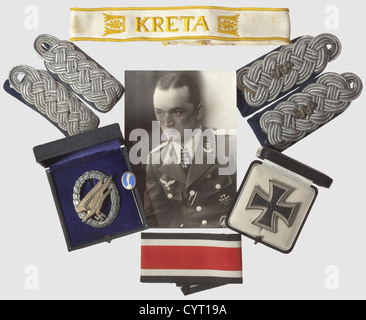 Knight's Cross winner Dr. Rolf Jäger(1912 - 1984),orders,decorations and insignia An extensive group consisting of four 'Kreta' cuff titles,an Iron Cross 1st Class by maker 'L 58'(Rudolf Souvall)with threaded disc attachment in LDO case,an Iron Cross 1st Class without maker's mark in award case,a further EK1(no maker),and a Parachutist's Badge(maker Berg & Nolte,Lüdenscheid)in award case. Further,Jäger's large 4-piece orders clasp with the following awards: Iron Cross 2nd Class(with round '3',indicating an early award),War Merit Cross 2nd Class,Additional-Rights-Clearences-Not Available Stock Photo