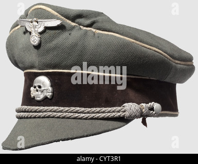 An old style visor cap,for officers of the Waffen-SS Cap with cloth visor of fine field grey gabardine with black velvet cap band,white piping,silver cord. The light brown silk inner liner with salino,the leather sweat band damaged. Replaced aluminium insignia with vestiges of silvering(missing pins). The cap with signs of usage and moth damage. An extremely rare cap,historic,historical,1930s,1930s,20th century,Waffen-SS,armed division of the SS,armed service,armed services,NS,National Socialism,Nazism,Third Reich,German Reich,Germany,milit,Additional-Rights-Clearences-Not Available Stock Photo