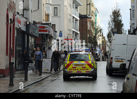 Police car patroling St james's Street Brighton UK Stock Photo