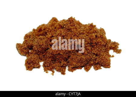 Pile of dark brown soft sugar, isolated on a white background Stock Photo