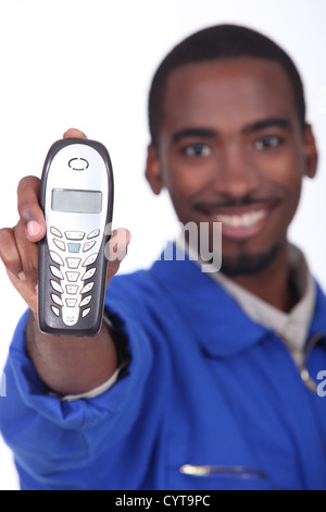 Technician showing landline phone Stock Photo