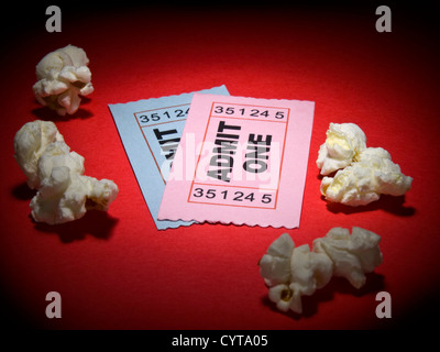 Close up shot of two generic admission tickets and some popcorns arround. Stock Photo