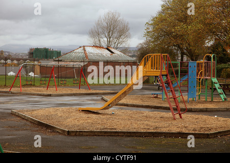 Deserted children's playground in the park at Burlias, Swansea, South Wales, UK Stock Photo