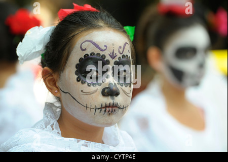 A girl seen venerating the saint of 'Santa Mauerte' as part of Mexico's traditions Day of the Dead in Pedro Escobedo, Mexico Stock Photo