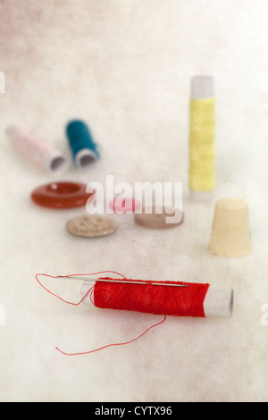 needle, threads, buttons and a thimble Stock Photo