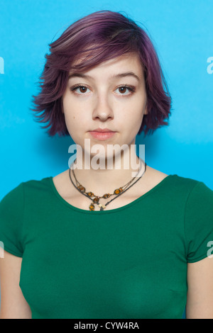 Cute modern and urban looking girl on blue background Stock Photo