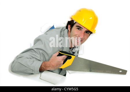 Tradesman holding a  saw Stock Photo