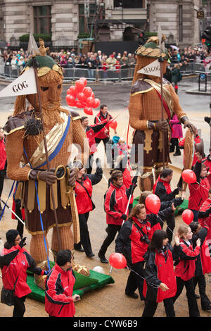 The Lord Mayor's Show Saturday 10 November 2012. Mansion House, City of London, UK. Picture shows Gog and Magog, the traditional guardians of the City of London, which have been carried in the Lord Mayor's Show since the reign of Henry V at The Lord Mayor's Show 2012 outside Mansion House, where Alderman Roger Gifford begins his role as The Lord Mayor, who serves a one-year, unpaid term, plays an ambassadorial role for the Square Mile, typically spending three months abroad promoting the finance industry as well as receiving delegations in London, City of London, England, UK. Stock Photo