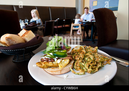 Chicken sandwich with fried zucchini at a restaurant in Orlando, Florida. Stock Photo