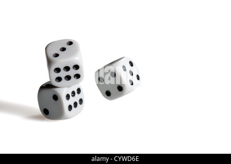 Throwing black and white dices for playing a game Stock Photo