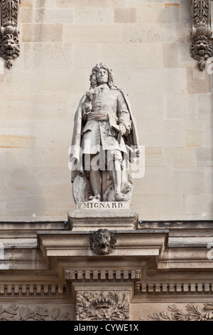 Statue of Pierre Mignard (1612 - 1695), French artist, in the Cour Napolean, Louvre Museum, Paris, France Stock Photo